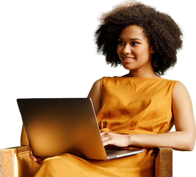 Woman looking up from laptop computer